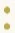 Two yellow dots stacked one on top of the other a moderate amount of space apart, used as a page divider. 